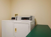 Washer and dryer at Country Inn & Suites by Radisson. 