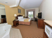 Enjoy a restful stay in the suite with a luxurious king bed.