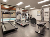 Fitness center with view of the pool