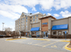 The front exterior of the Country Inn & Suites by Radisson and the IHOP to the right of it in Bloomington, Minnesota.