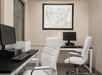 Business center with two computers and a printer.