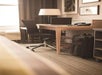 Work desk with chair inside a guest room.