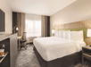 Enjoy a restful stay in a guest room with a king bed, flat-screen TV, and work desk.
