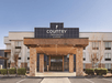 The hotel entrance welcomes you with an inviting atmosphere.