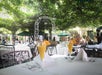 Two glasses of Mamosa's on the table in the outdoor courtyard at Court of Two Sisters.