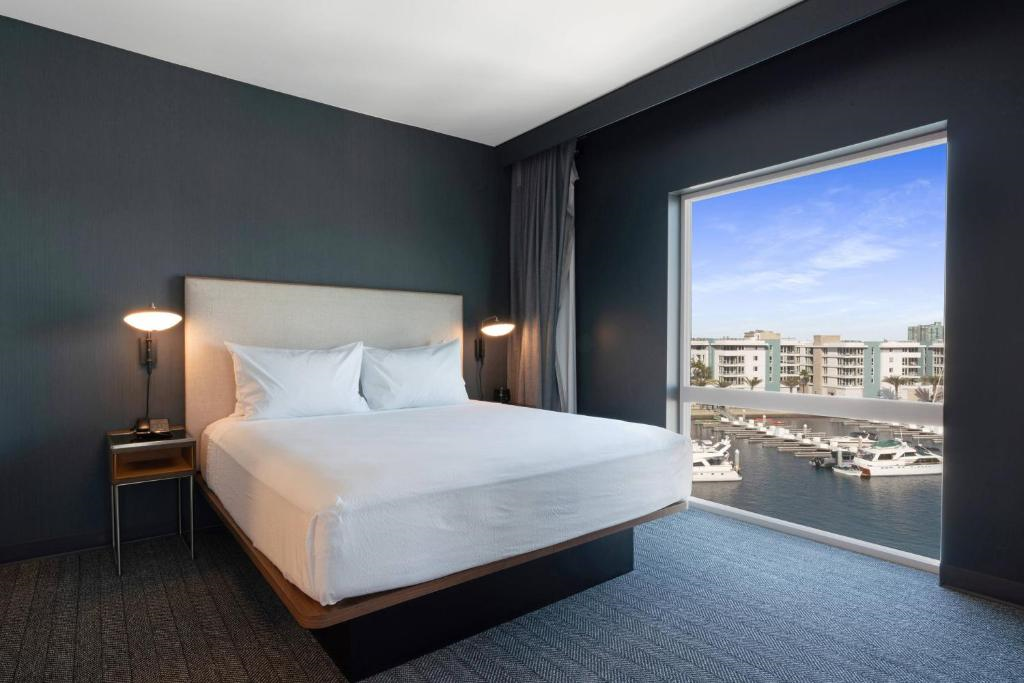 Sleep comfortably in guest room with one king bed and marina view.