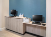 Business center with computer desktops.