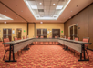 Meeting facility with U-type seating setup.