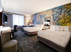 2 Queen beds, work desk, flat-screen TV at Courtyard by Marriott Louisville Airport, KY.