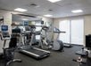 Fitness center with weights and cardio equipment.