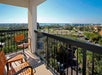 Balcony with outdoor furniture at Courtyard by Marriott Cocoa Beach Cape Canaveral. 