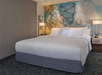 1 King bed inside a guest room.