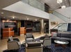 Hotel lobby with ample seating and front desk.