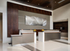 Modern hotel lobby with two sleek reception desks, minimalist decor, and a large abstract wall art piece.
