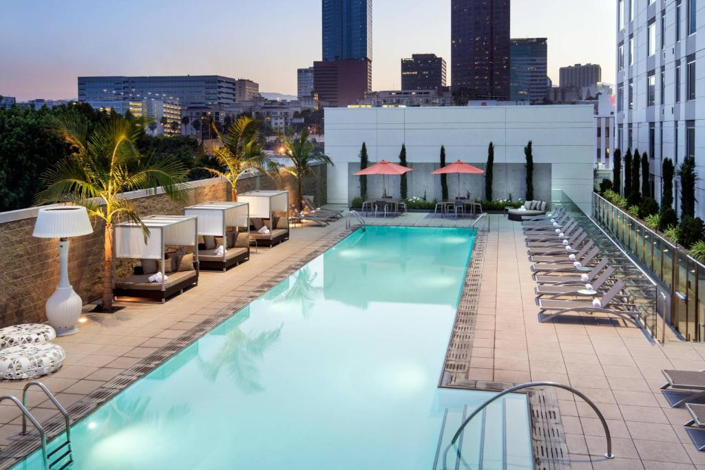 Dive into the outdoor pool or relax on one of the sun loungers.