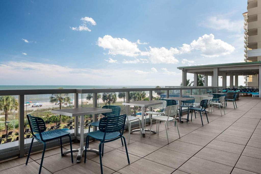 Outdoor dining with view of the ocean.