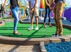 Guests stand on the green on the outside course at Crave Golf Club in Pigeon Forge, TN