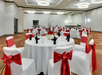 Ballroom with tables and chairs.