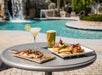 Enjoy a relaxing day with food and beverage in the outdoor pool at Crowne Plaza Orlando Lake Buena Vista.