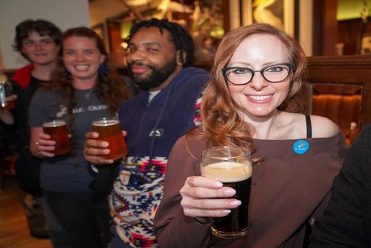 Tourgoers with beer in hand during the DC Insider’s Pub Crawl in Washington, DC.