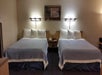 Two queen beds in a guest room.