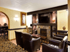 A lobby / lounge with fireplace at Days Inn Charlotte/Woodlawn Near Carowinds.