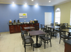 Breakfast area with ample seating, microwave, waffle/pancake machine and more.