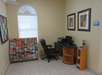 Business center with a computer and printer.
