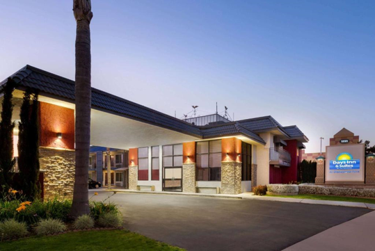 Hotel exterior at dusk.