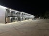 Hotel exterior at night.