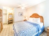 One queen bed inside a guest room.