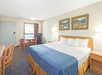 1 King Bed at Days Inn by Wyndham Valdosta at Rainwater Conference Center.