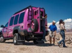 The tourist getting off the Jeep to start the tour