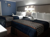 Two queen beds inside a guest room.
