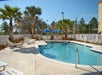Gated outdoor pool at Destiny Palms Hotel in Kissimmee, Florida.
