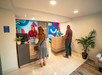 Guests standing by the front desk.