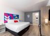 Guest room with one king bed.