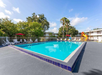 Enjoy sunny Florida in the outdoor pool and a kids' playground next to it.