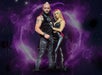 A man and woman in black leather outfits stand together in front of a swirling purple and black background. The man holds metal claws in one hand.
