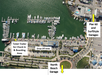 Aerial view of a marina with labeled areas: Ticket Trailer for Check-In & Boarding, Drop Off Area, North Beach Garage, and Pier 60 and SurfStyle Garages. Boats are docked in the water.