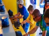 Young boys holding mallets playing wack-o-mole at Dorney Park in Allentown, Pennsylvania.