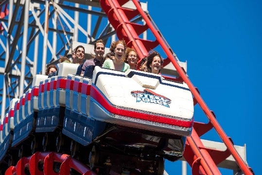 A car full of people starting to go  downhill on the Steel Force roller coaster at Dorney Park in Allentown, Pennsylvania.