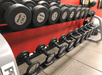 Fitness facility with dumbbells.
