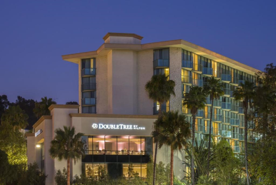 Hotel exterior at night time.