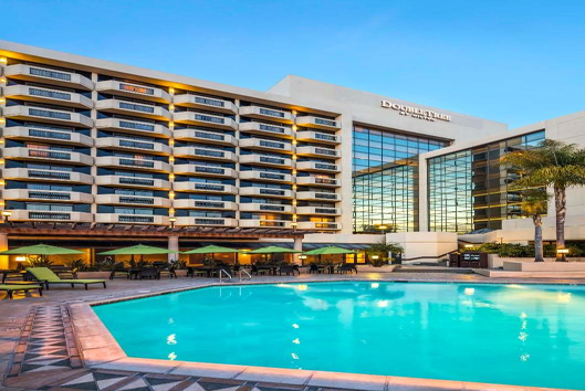 Exterior view of the hotel and the pool area.