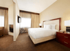 Guest room with one king bed at DoubleTree Suites by Hilton Hotel Cincinnati - Blue Ash, OH.