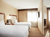 Guest room with two double beds at DoubleTree Suites by Hilton Hotel Cincinnati - Blue Ash, OH.