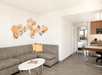 Seating area with a sofa bed and a kitchenette.