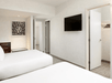Two queen beds inside a non-smoking room.