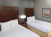 2 double beds inside a non-smoking guestroom at DoubleTree by Hilton Asheville - Biltmore in Asheville, NC 